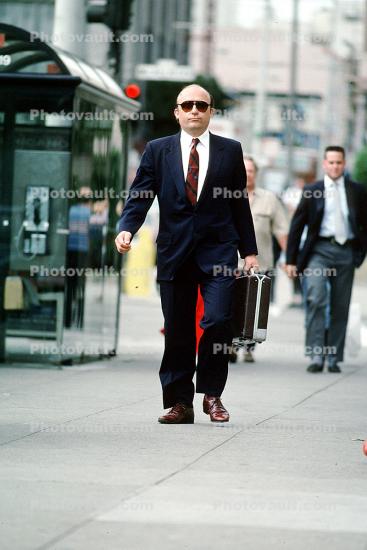 Businessman, briefcase, walking, sidewalk