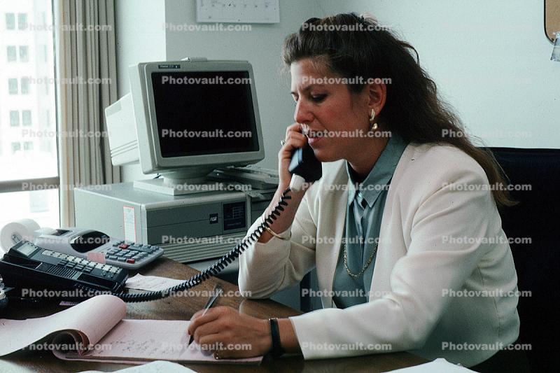 Business Woman, desk, phone, talking, conversing, connection, landline, IBM computer, calculator, writing pad, notes