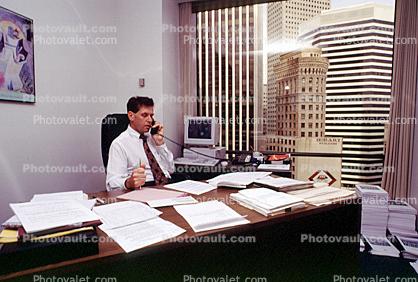 Man, Male, Paperwork, computer, phone, conversing, landline, desk, office, 1990's, businessman