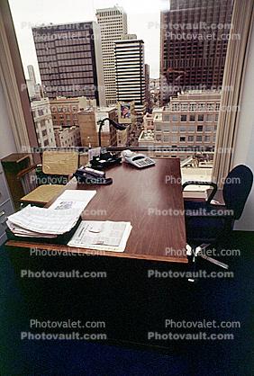 Desk, office, adding machine, buildings, in-out trays, telephone, landline, paperwork, stack