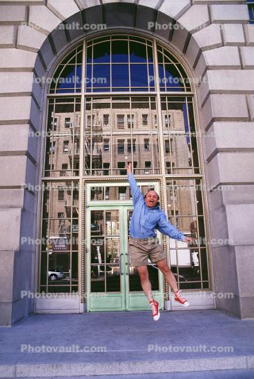 Man, Shorts, jumping, joy, success, happy, building, casual business man, red shoes, businessman