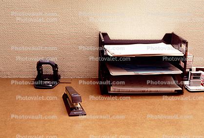 Desk, Hole Punch, Stapler, Paper Stacks, paperwork, bureaucracy, piles, archive, clutter, documents, in-out trays