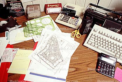 calculator, keyboard, radio, clutter, radio, cordless phone, desk, paperwork, stencils