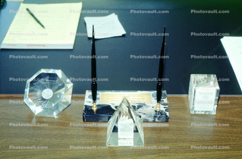 glass pyramid, pen, writing pad