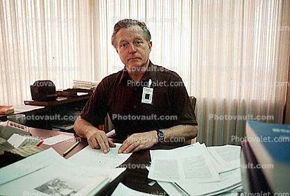 Desk, office, Man, phone, paper, paperwork, Male, Guy, Masculine, Adult, Smiles, Laugh, Laughing, 1979, businessman, 1970s
