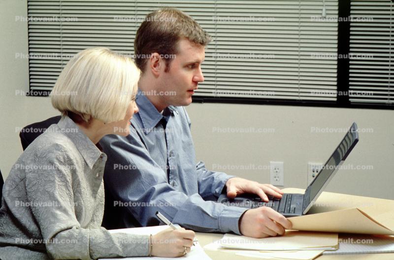 Laptop Computer, file folder, woman, man, meeting