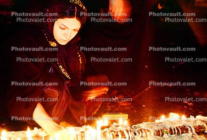 Women Lighting Candles
