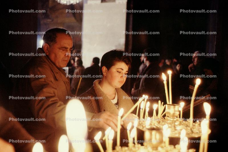Women and Men lighting Candles, Church Services at the end of the fighting in Tblisi, 1992