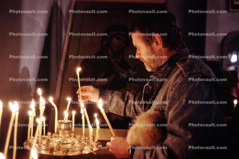 Man lighting Candles, Church Services at the end of the fighting in Tblisi, 1992