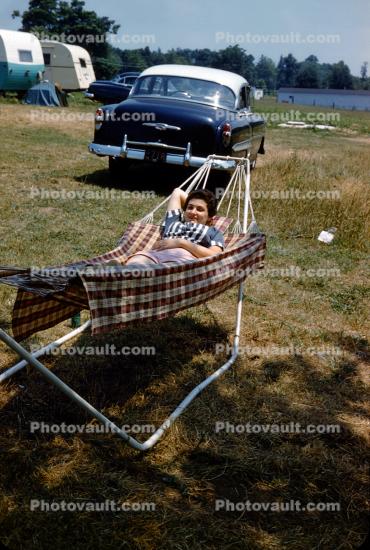 Woman relaxing on a Hammock, Chevy Belair Car, 1950s