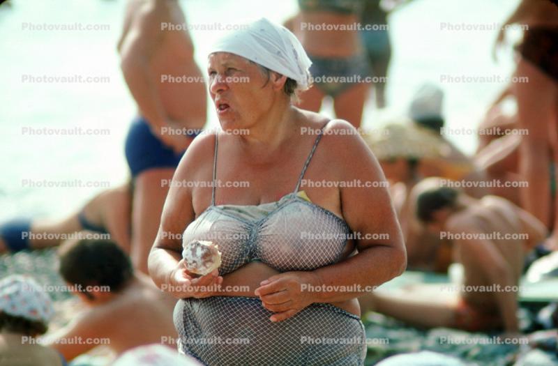 Overweight Lady eating a donut, Sochi Russia