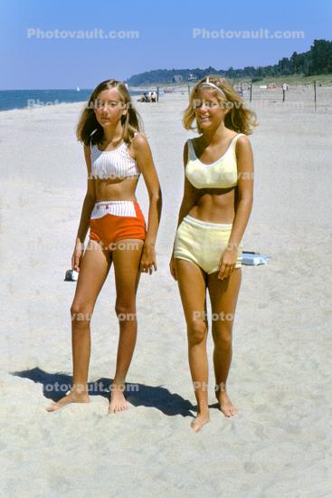 Girls walking on the beach, 1960s