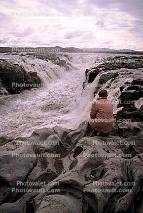 Lady Gazin into a Waterfall in Iceland