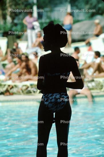Lady Standing at a Swimming Pool
