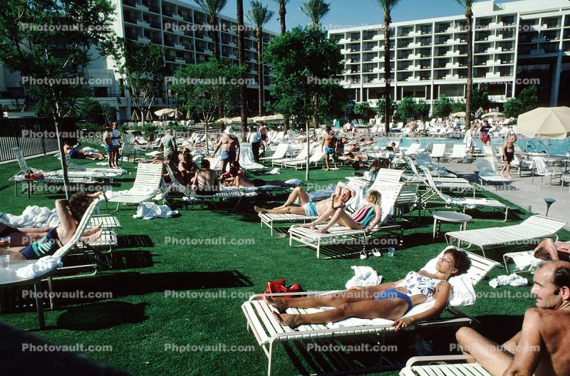 Crowds Lounging at a Swimming Pool, Lounge Chairs, Hotel