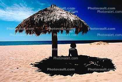 Woman on a Beach, Pacific Ocean, sand, grass thatched parasol, shade, shadow, Sod