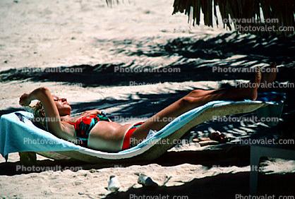 Lady Sunning on a Lounge Chair, sun tan