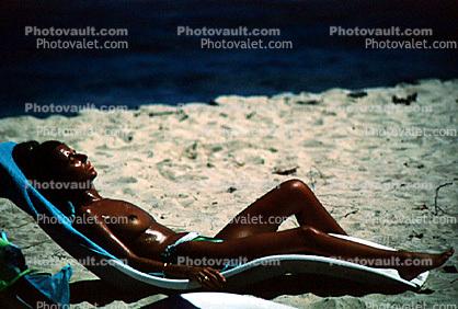 Lady Sunning on a Lounge Chair, sun tan