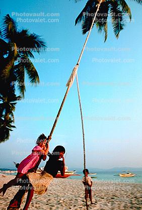 Children on a Rope Swing, Beach, Baracay, Philippines