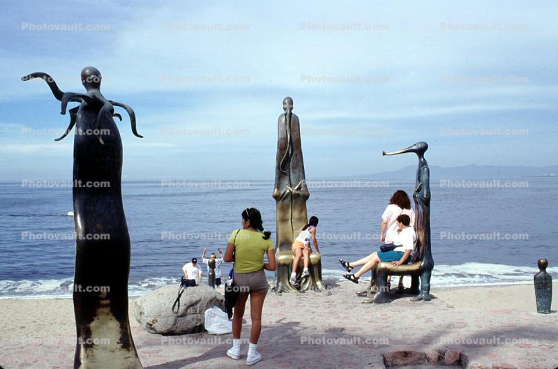 statues, people, ocean