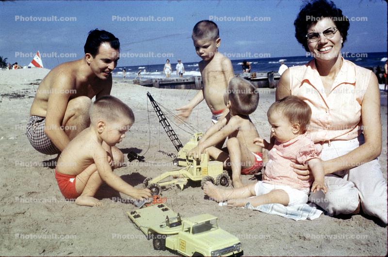 Playing on the Beach, Toys, Woman, Father, son, shirtless, smiles, retro, 1950s