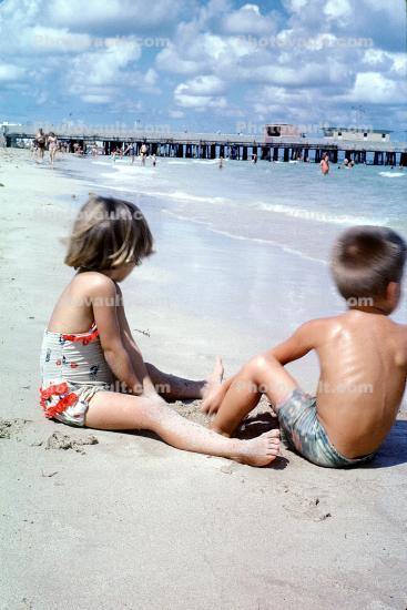 Children playing on the beach, Pier, 1960s