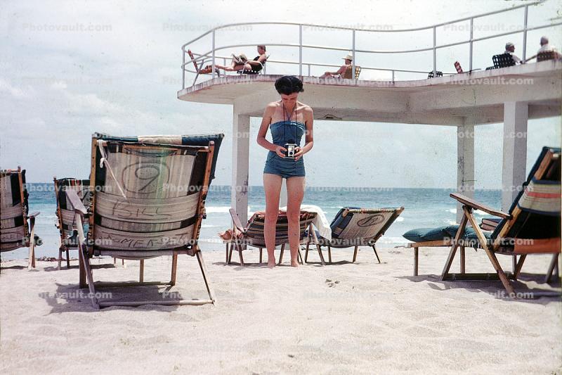 Brownie Camera, Beach, Ocean, Woman, Deck, Chairs, 1950s, taking a picture, kodak brownie, Sand