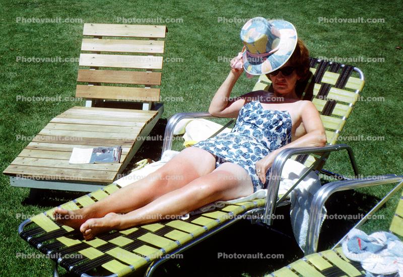 Woman relaxing on a lounge chair, 1950s