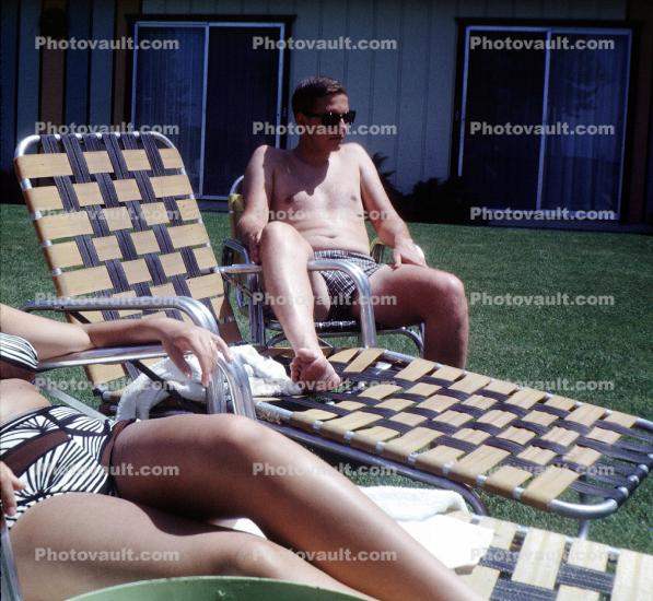 Woman and Man relaxing on a lounge chair, 1950s