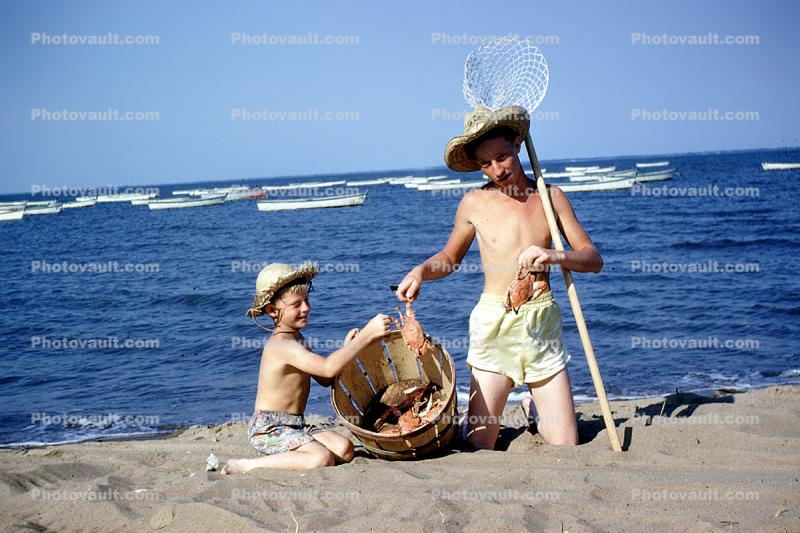 crab fishing, sand, beach, water, ocean, net, boys, hats, boats, Woodland Beach, 1950s
