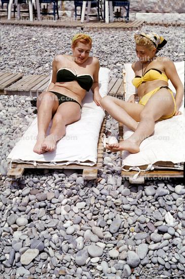 Pebbles, rocks, Sand, women, lounging, Women Sunning, Beach, bikini, sun worshiper, 1970s