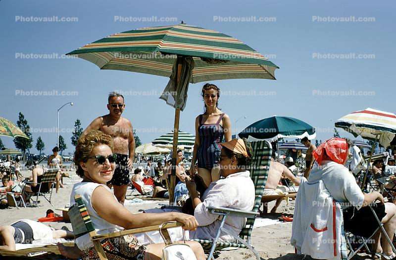 Man, Woman, beach, sand, sun, parasol, 1958, 1950s