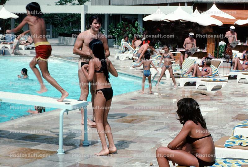Swimming Pool, Poolside, lounge chairs, umbrellas, parasol, 1977, 1970s