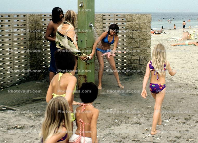 Shower, Beach, Sand, Girl washing off a starfish, 1974, 1970s