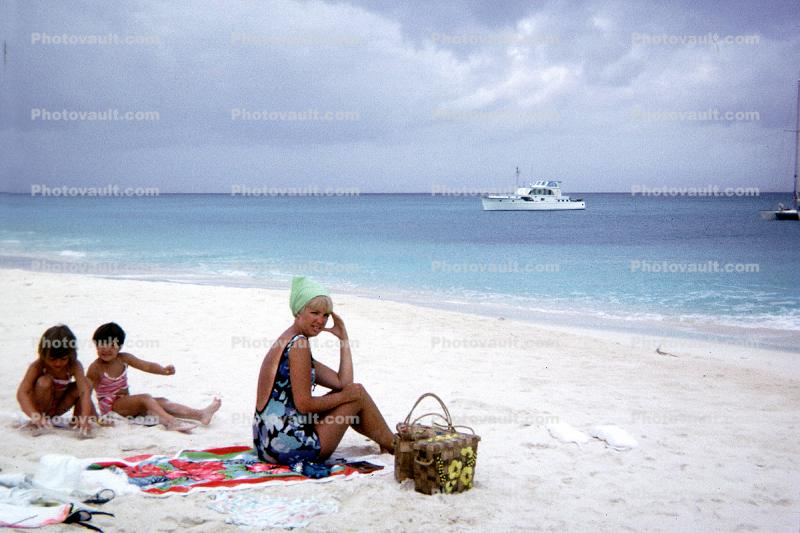 Women, boat, shoreline, sand, beach, Cayman Islands, 1966, 1960s