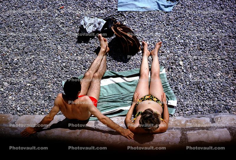 Man, Woman, Pebbles, Bikini, Beach, Tanning, Suntan, Sunburn, Sun Worshippers, Nice, France, 1960s