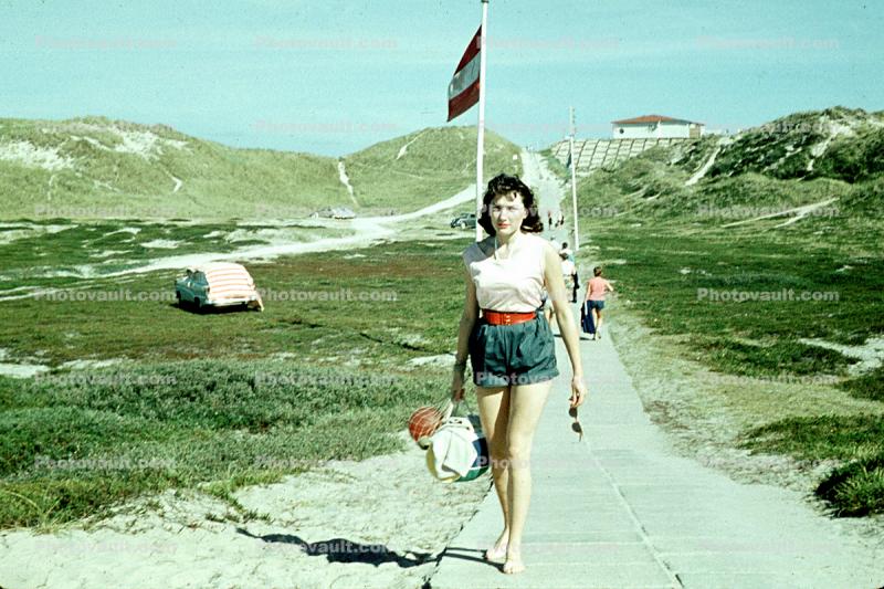 woman in shorts, walking, 1950s