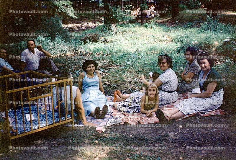 Backyard, Women, Girl, Crib, blankets, lawn, 1950s