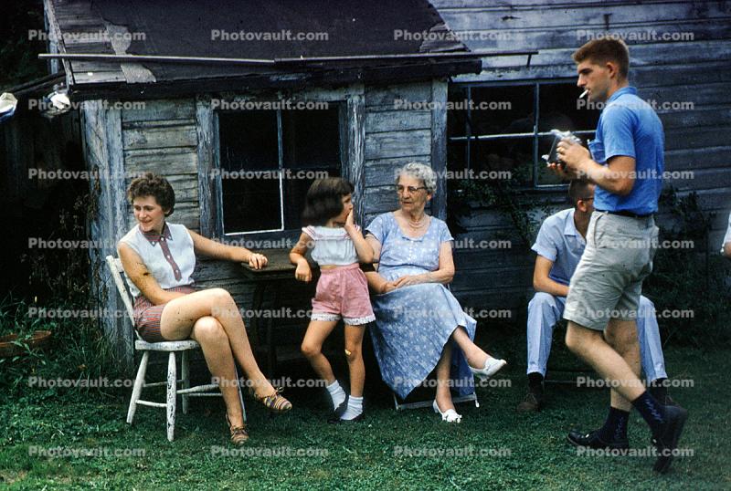 sitting folk, cabin, smoker, 1950s