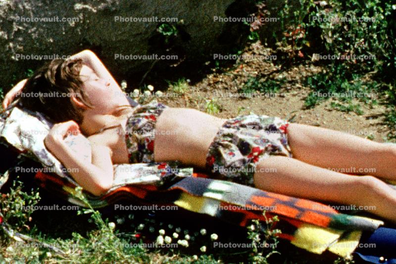 Girl on a loungchair, bathingsuit, 1960s