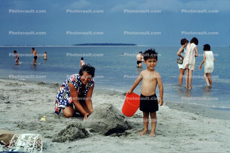Boy, sand, beach, Atlantic Ocean, sand castle, pail, bucket, Cranes Beach, Massachusetts, 1966, 1960s