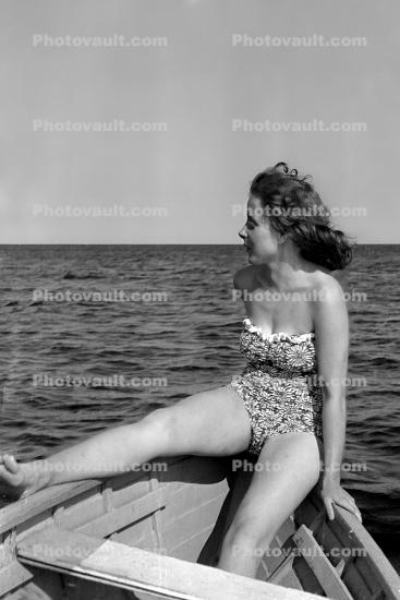 Woman on a rowboat, swimsuit, swimwear, 1940s