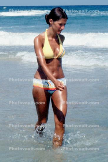 Woman wading, walking, beach, ocean, waves, suntan, sun exposure, sun burn, 1976, 1970s