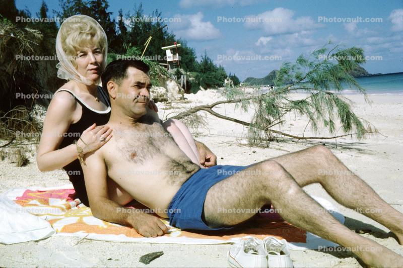 Woman, Beehive Hairdo, Man, beach, towel, 1960s