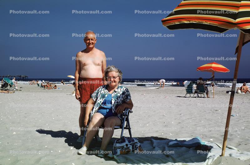Man, Woman, beach, sand, parasol