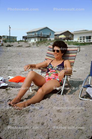 Woman Lounging on the Beach, chair, sand, Houses, shore