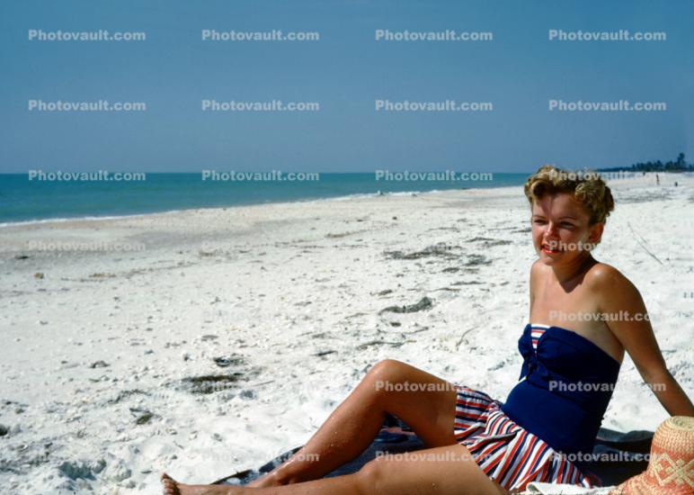 Woman Sitting in the Sun, beach, skirt, 1950s