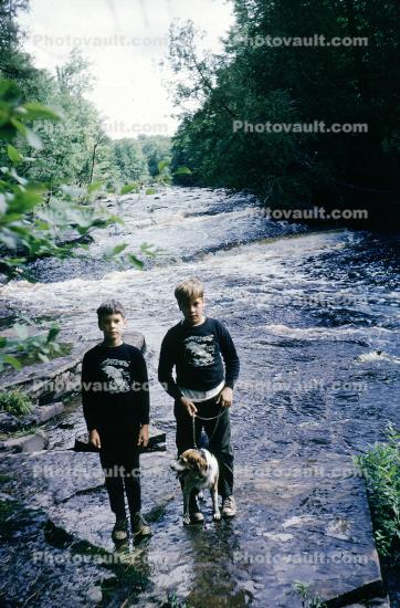 Boys on a River with Dog