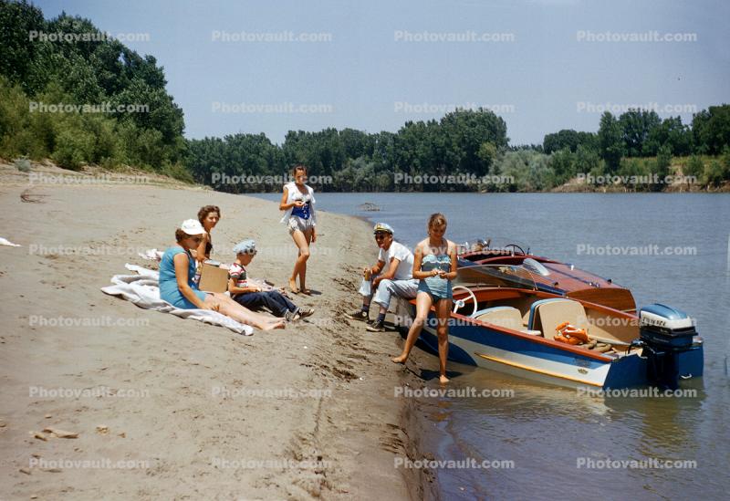 People sitting on a River Beach, Boats, Water