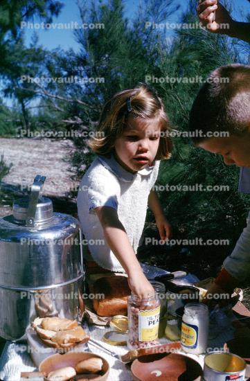 Girl at the Picnic Table, thermos, bread, 1950s